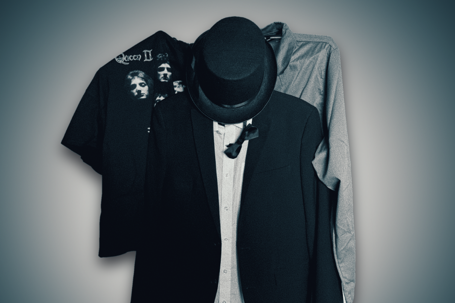 3 hangers on a wall with items of clothing on.