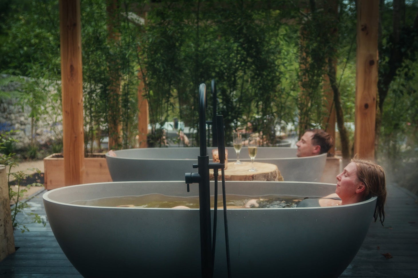 Friends enjoying a soak in seaweed baths at Drumhierny Woodland Hideaway in Leitrim.