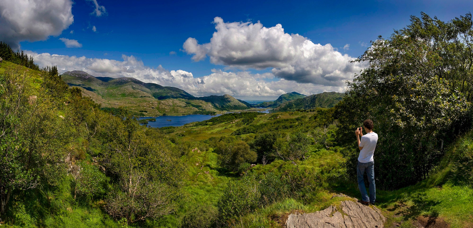 A man looking out at Ladies View in County Kerry.