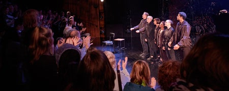 Th audience clapping for the performers in Citysong in the Abbey Theatre