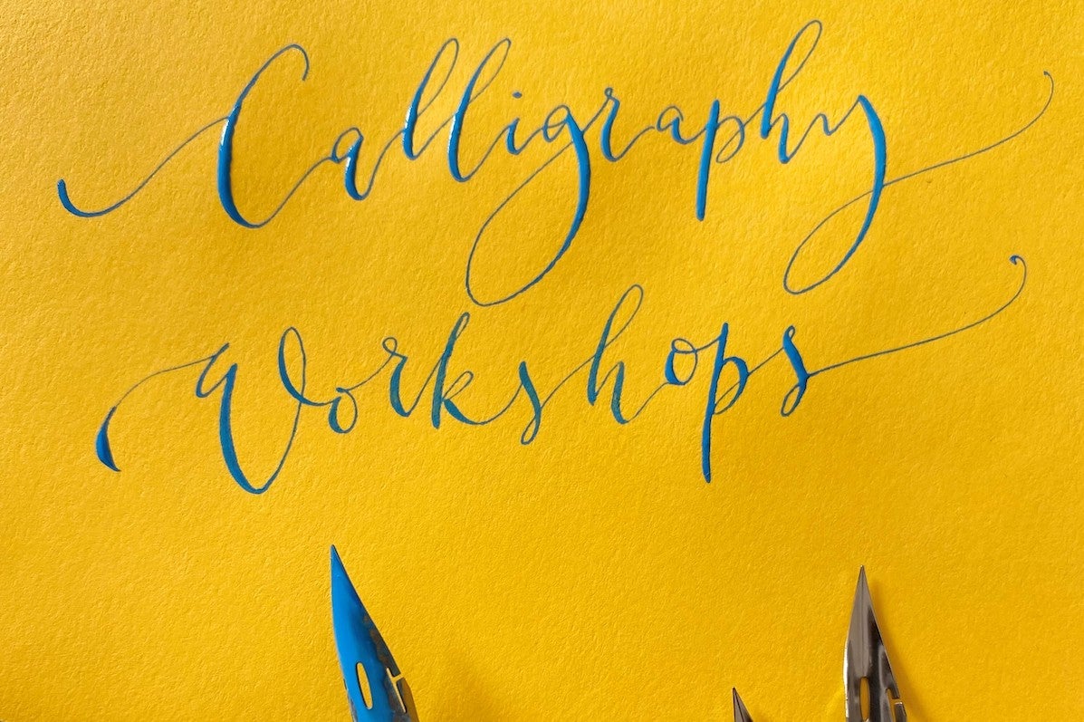 Modern Calligraphy with Sarah O'Dea - Bright yellow paper with curly, blue writing and some pen nibs.