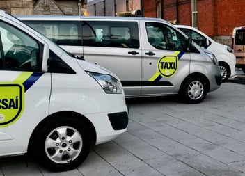 Several vans parked in a row