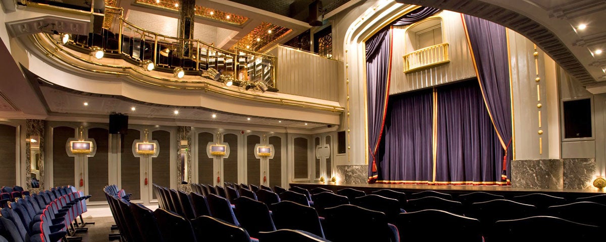 The stage and curtain of the set theatre from downstairs audience perspective and from the side