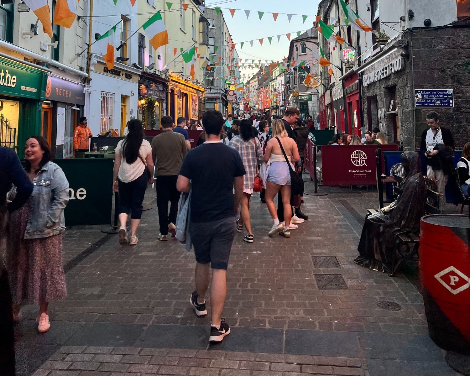 People walking down a busy city street