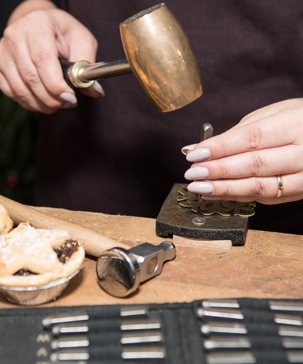 A person crafting a Christmas decoration in Silverworks in Dublin city
