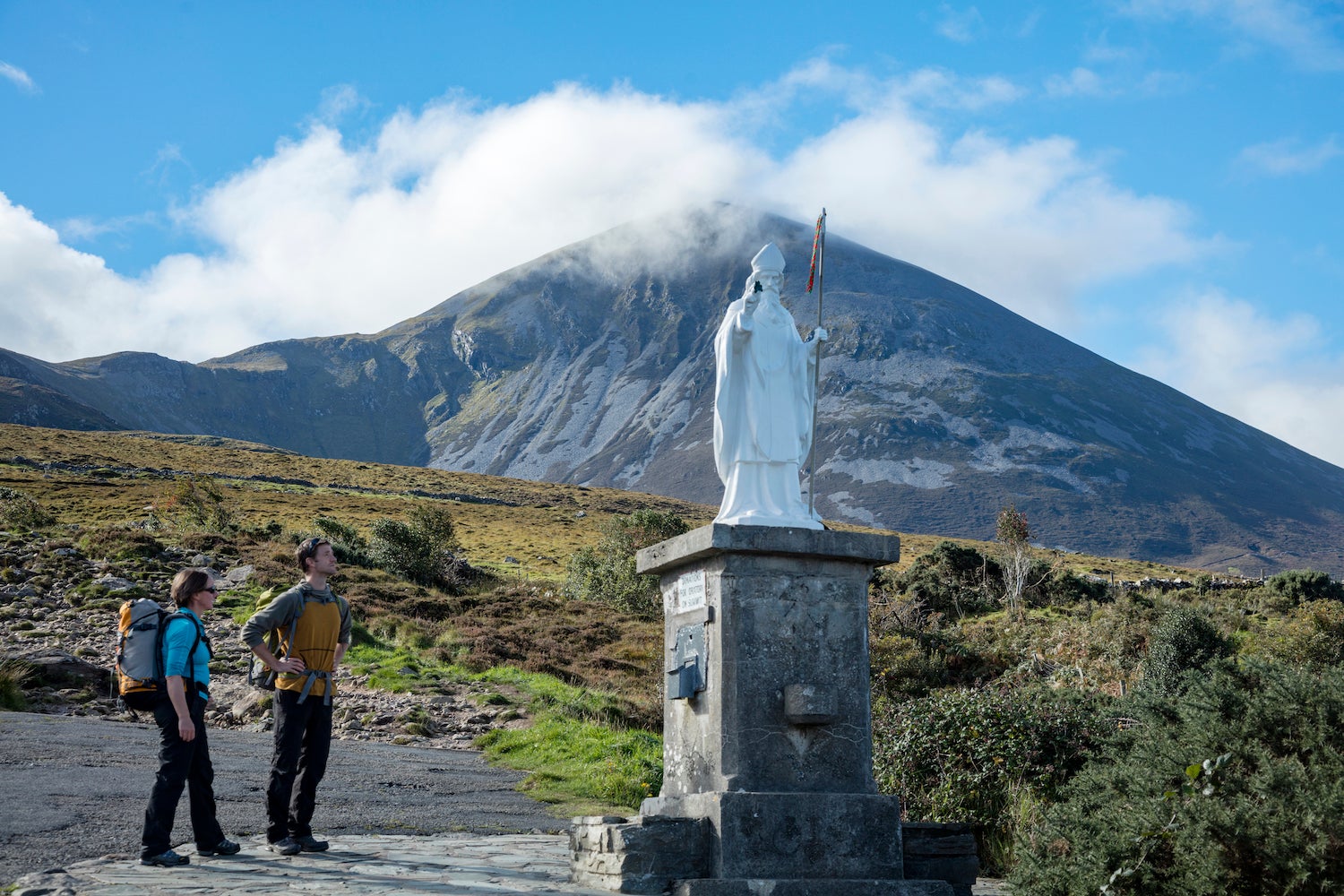 Hikers at the St Patrick statue on Croagh Patrick in Co Mayo