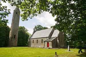 Timahoe Round Tower with Heritage Centre next door