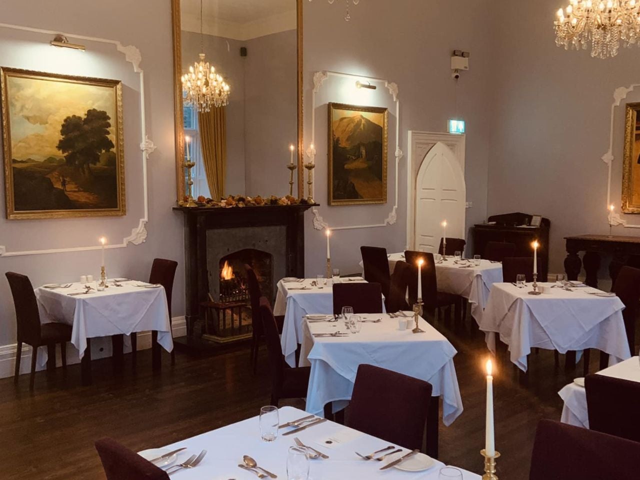 An empty dining area with prepared tables ready for diners
