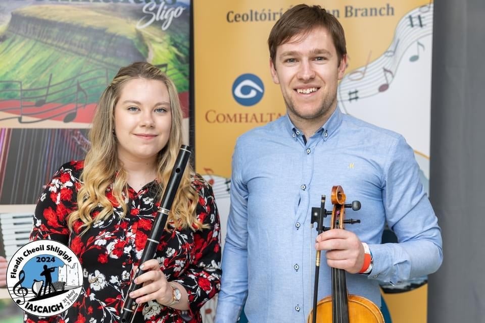 Jason and Lorna McGuinness with musical instruments