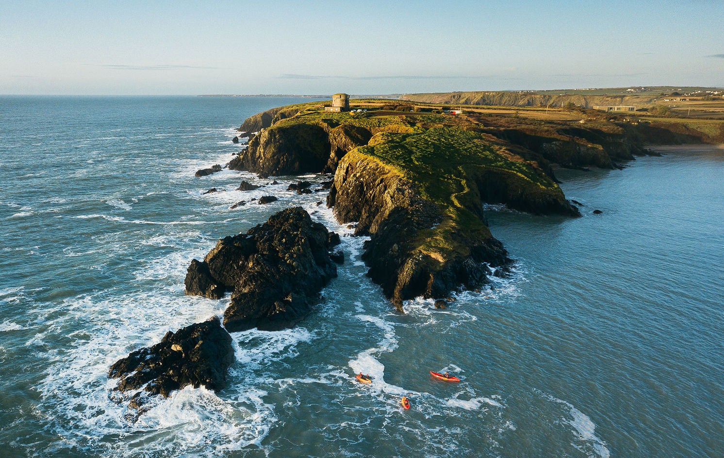 Aerial view of people kayaking along Hook Peninsula in Co Wexford