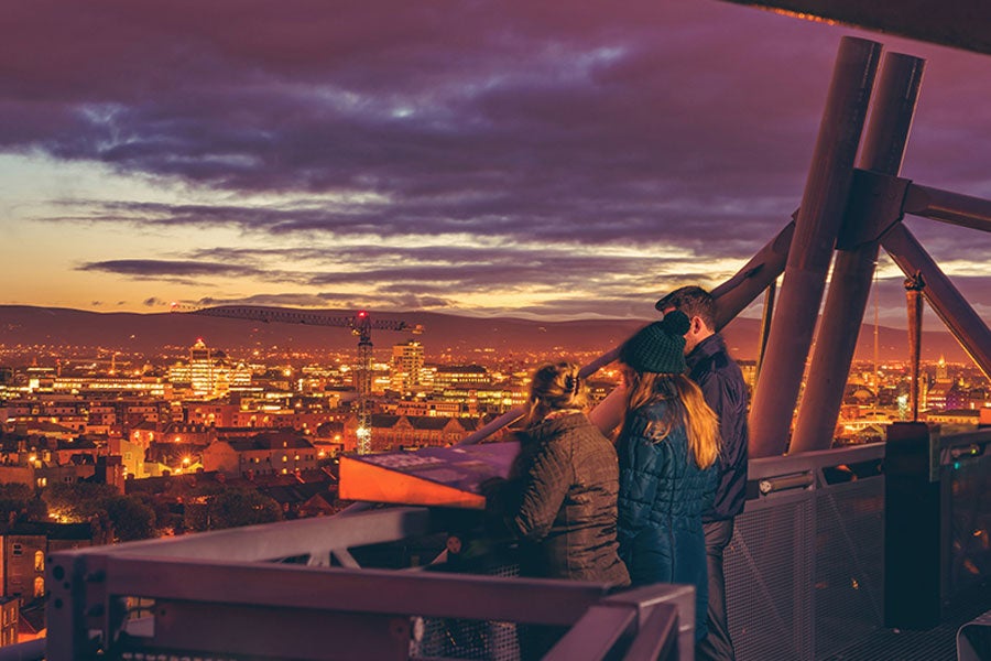 A group on the dusk tour at Croke Park over looking Dublin city