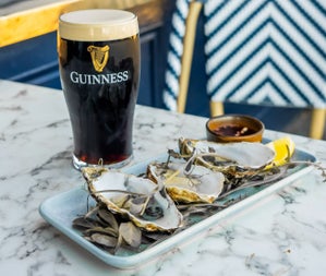 A plate of oysters with a pint of Guinness