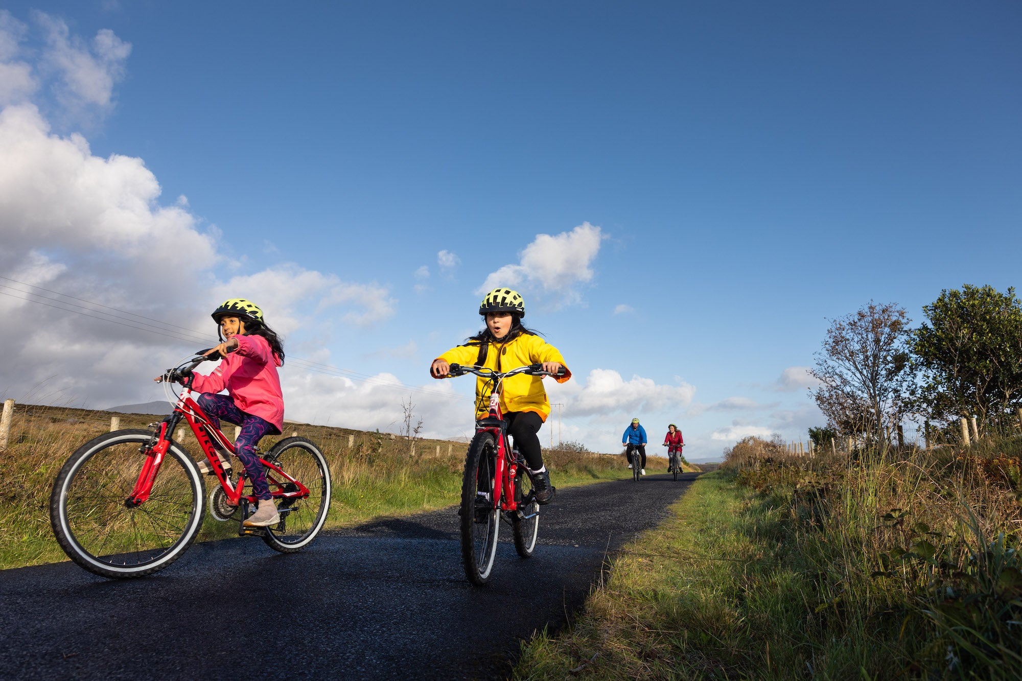 A family of four cycling the Great Western Greenway in County Mayo.