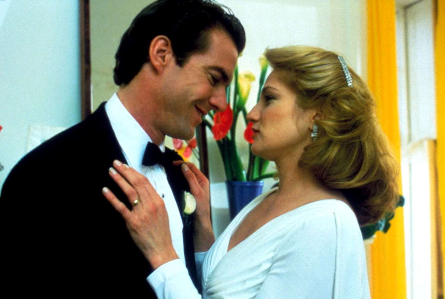 A man and a woman staring lovingly into each other's eyes.
