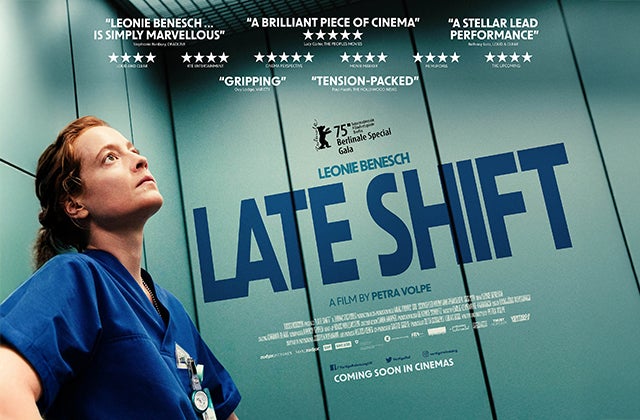 Film poster with a person in dark blue medics uniform in a lift looking thoughtful