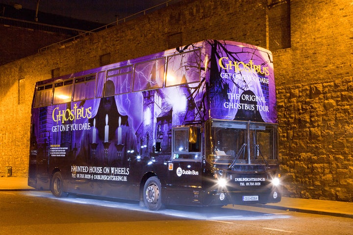 image of the original ghostbus tour bus at night time
