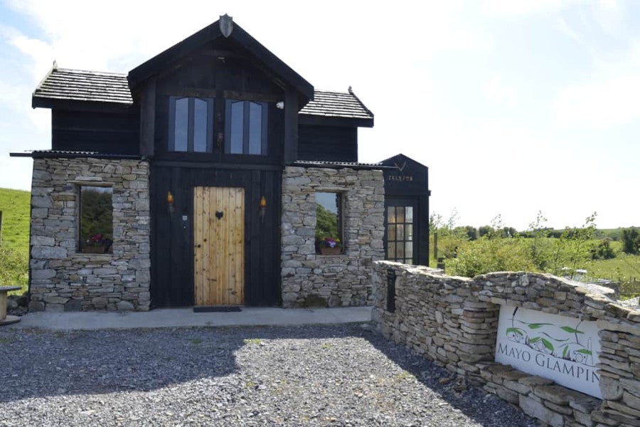 Front view of property with wooden door