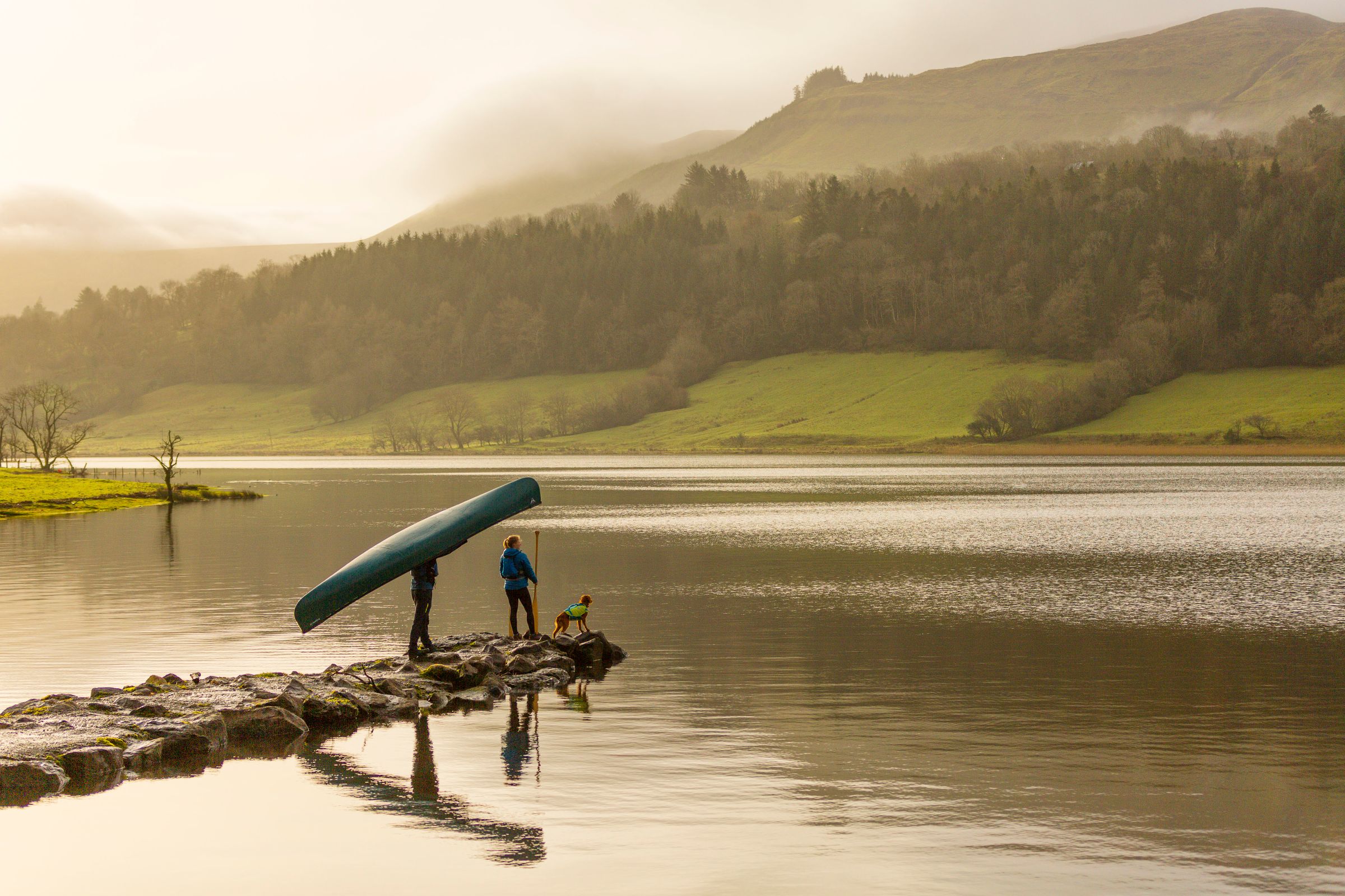 Image of a couple with their dog on Glencar Lake in County Leitrim