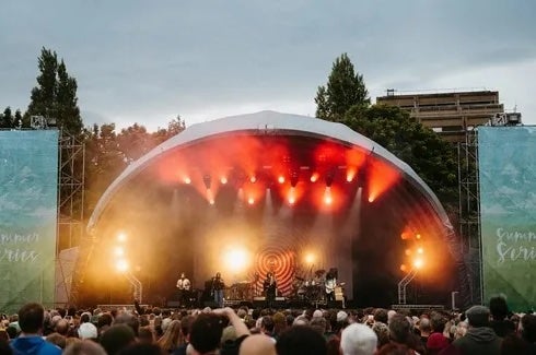 Trinity Summer Series 2026 - view of a dome shaped outdoor music stage with large audience