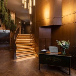 Reception area with a desk and stairs