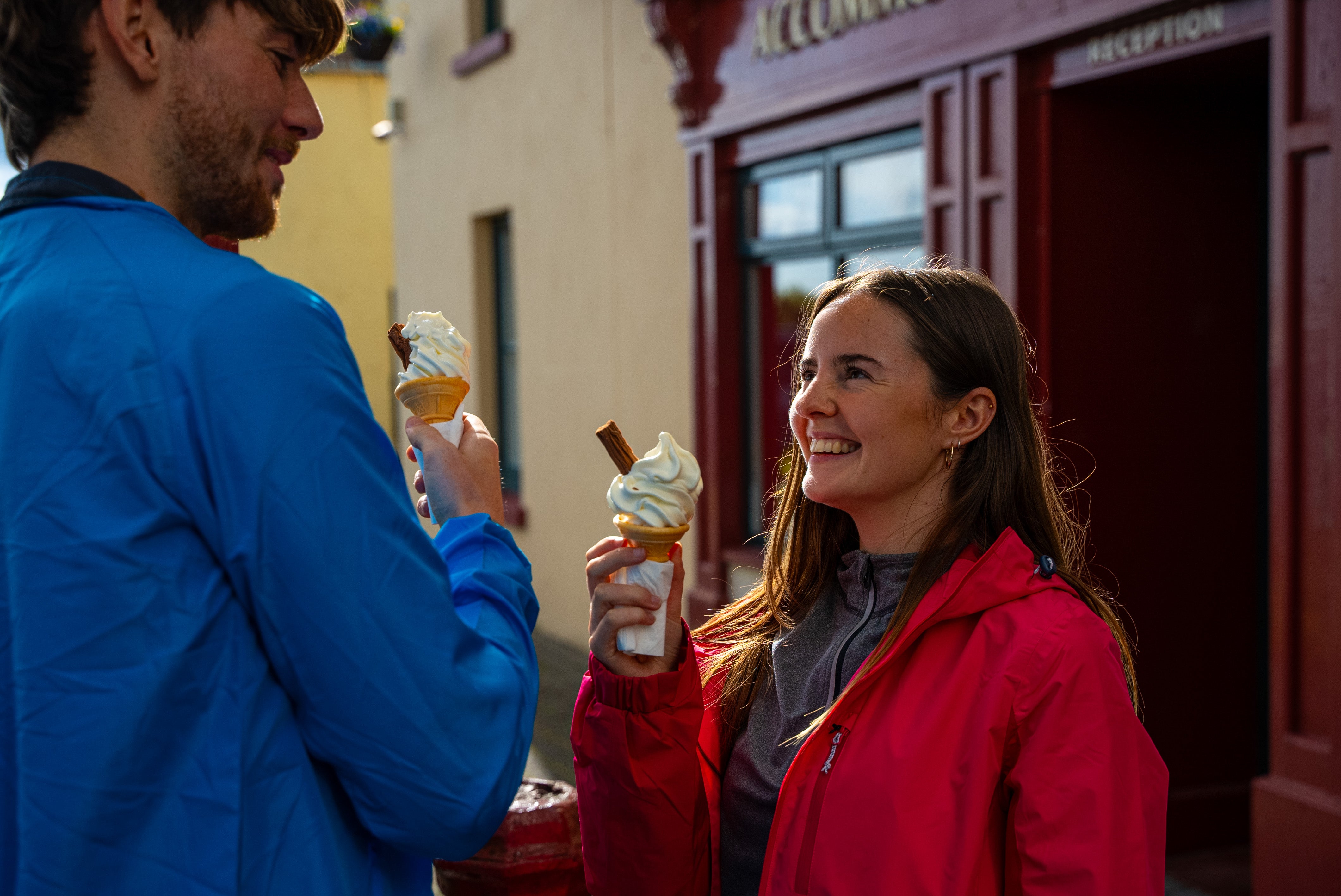 Couple enjoying a 99 outside a pub.