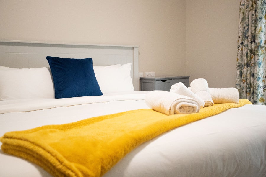 Double bedroom with white sheets