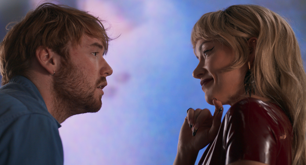 A man looking into the eyes of woman. He seems dishevelled and anxious whereas she seems elegant and confident.
