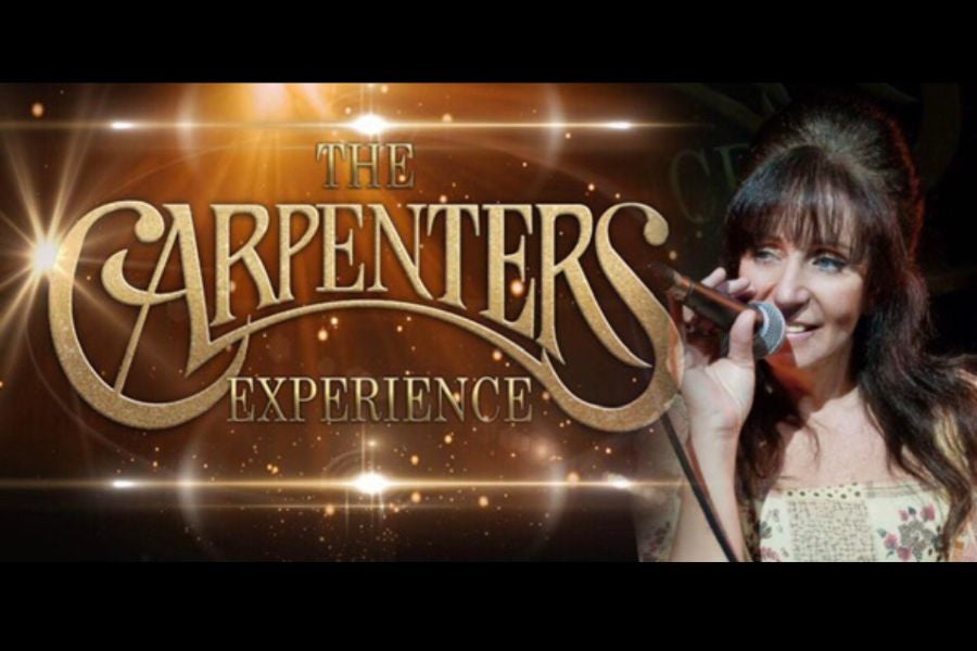 A woman holding a mic up to her mouth beside large gold event text.