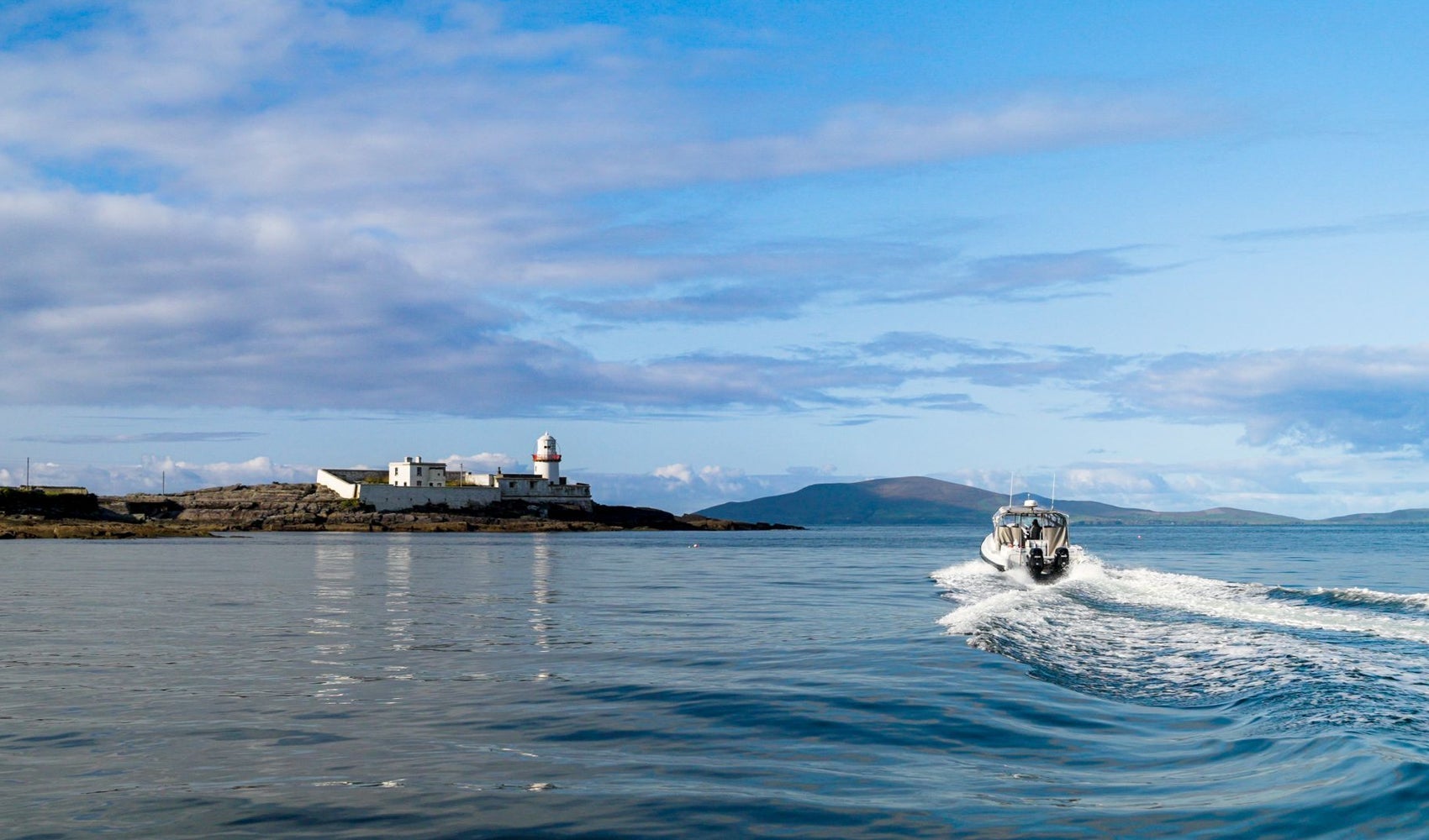 A view of Valentia Lighthouse with Valentia Island Experience - AquaTerra Boat Tours