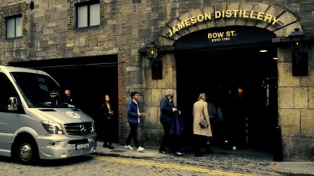 A group of people entering the Bow Street distillery