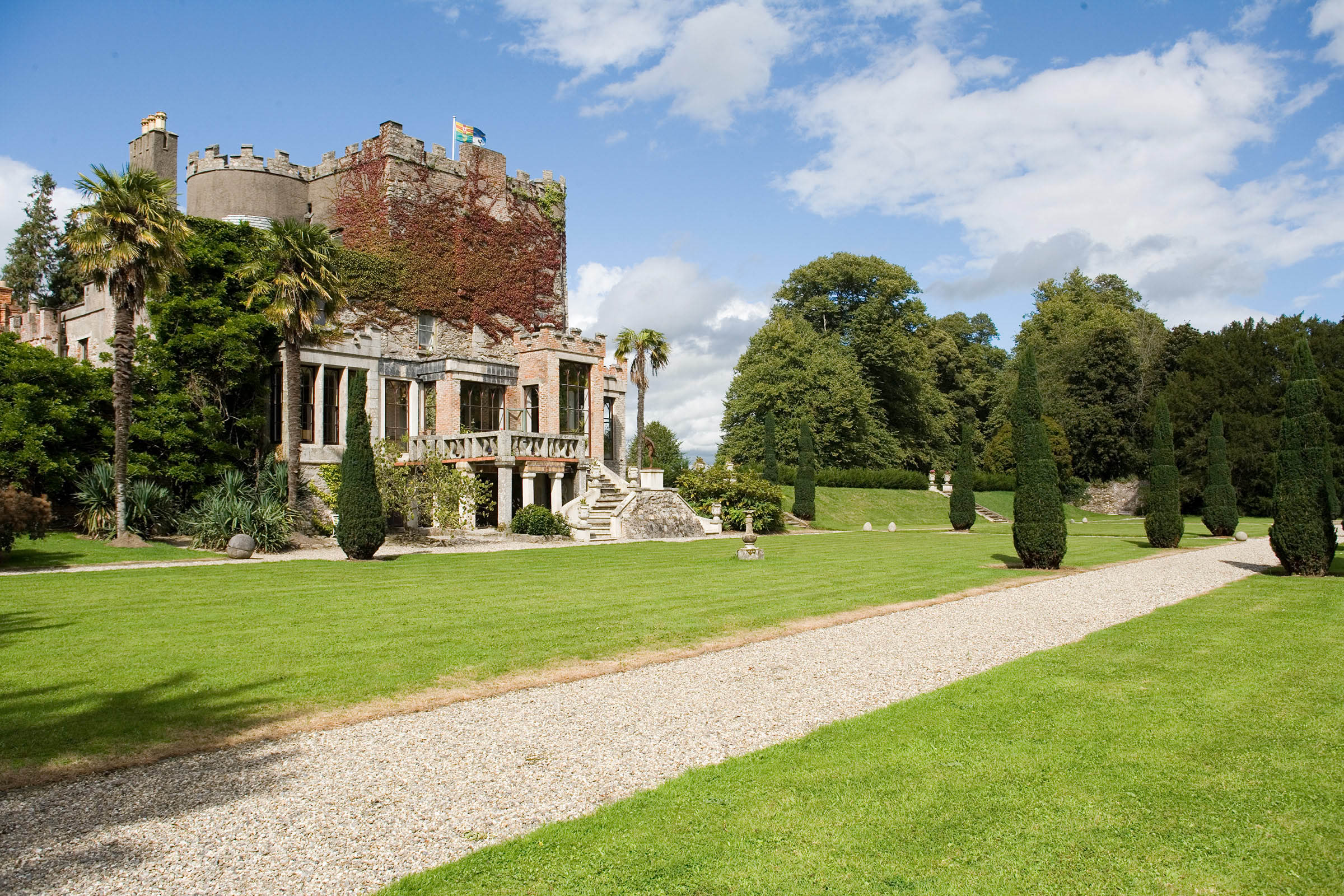 Exterior photo of Huntington Castle and Gardens with blue skies
