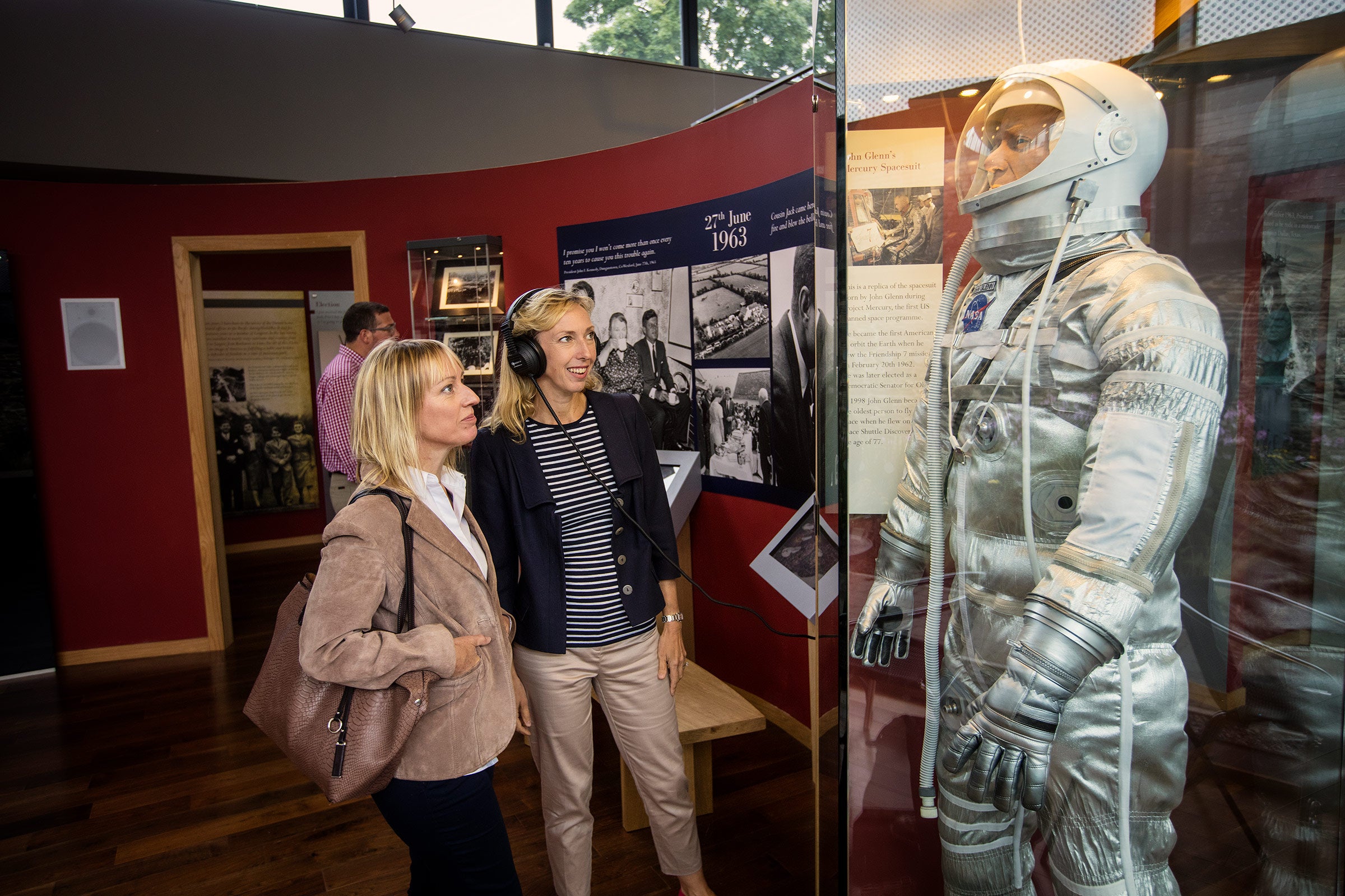 Two women looking at an exhibition at The Kennedy Homestead in County Wexford.