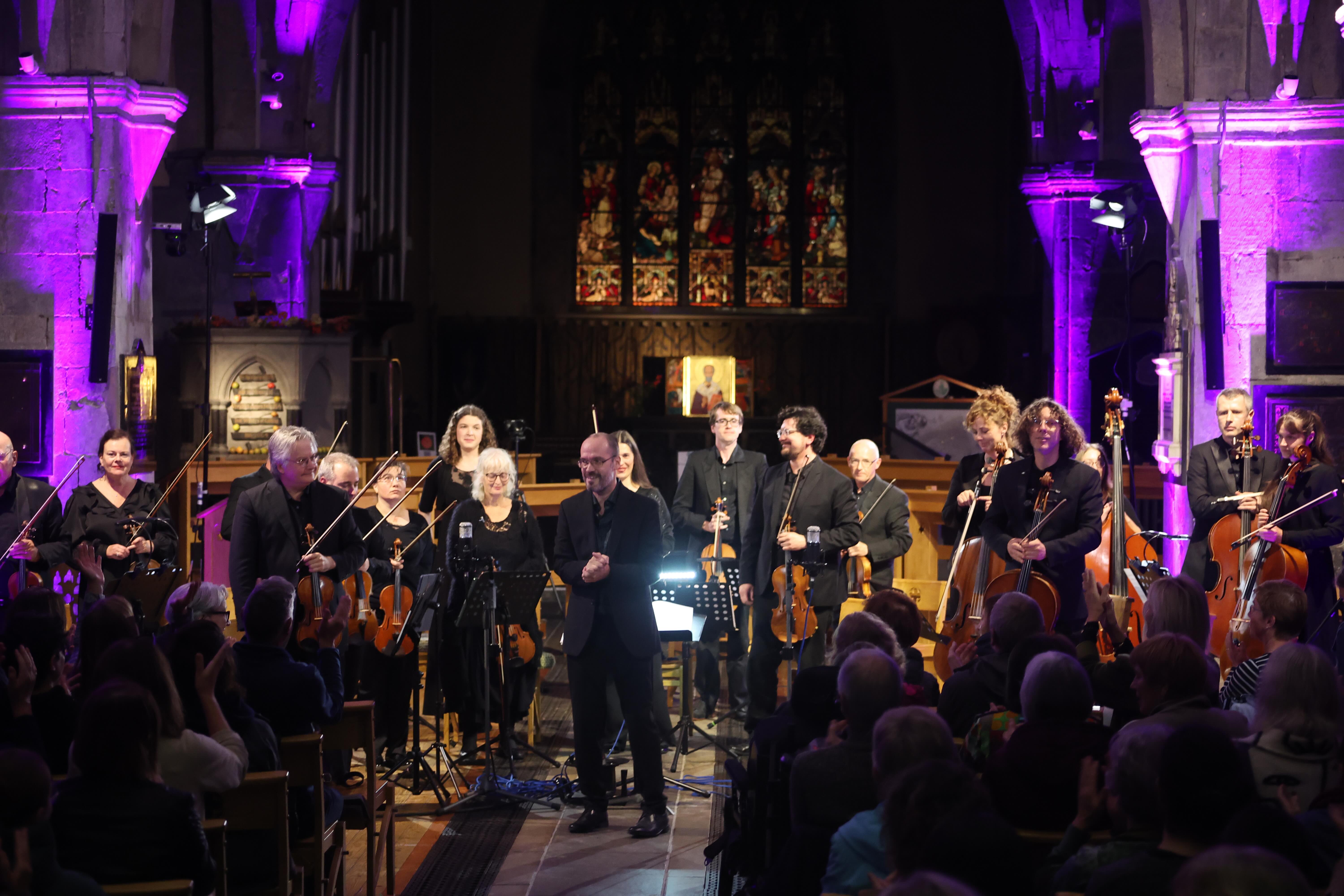 The Luminosa String Orchestra standing after their performance at St Nicholas' Collegiate Church, Galway
