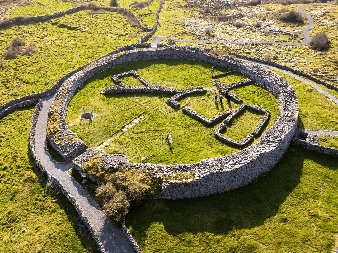 Aerial view of a stone ring fort surrounded by fields