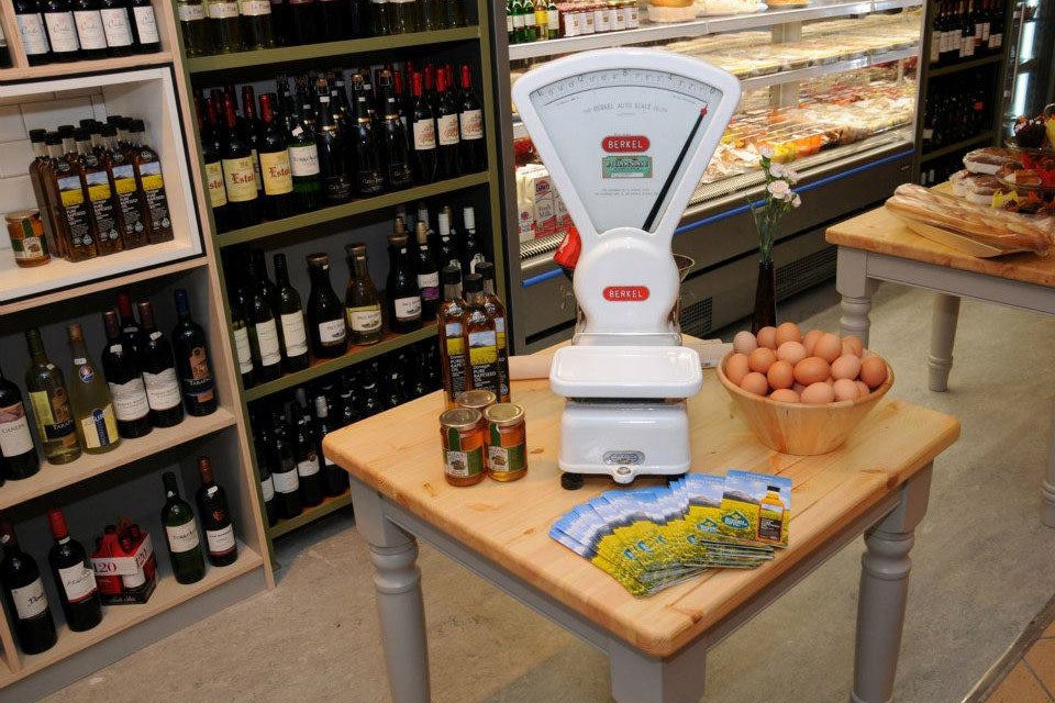 A scales and grocery items in Benny's Deli