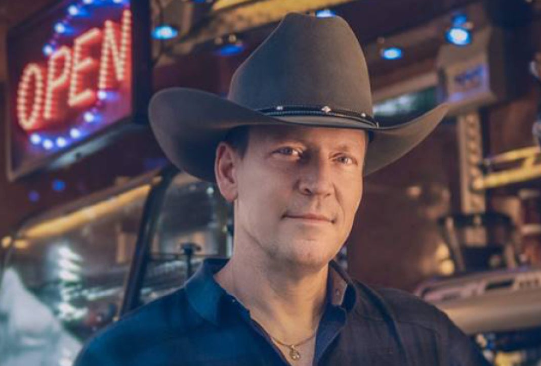 Robert Mizzell Dance - Gleneagle Arena, a gently smiling man in a brown cowboy style hat.