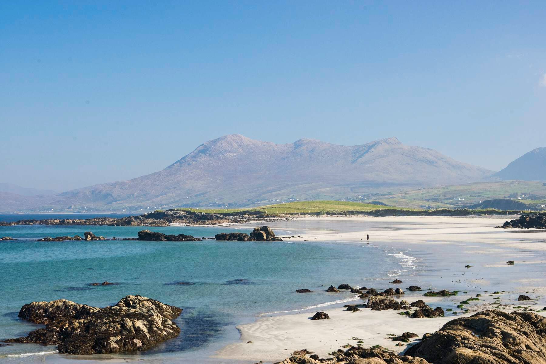 Renvyle Beach with sea and blue sky with mountain
