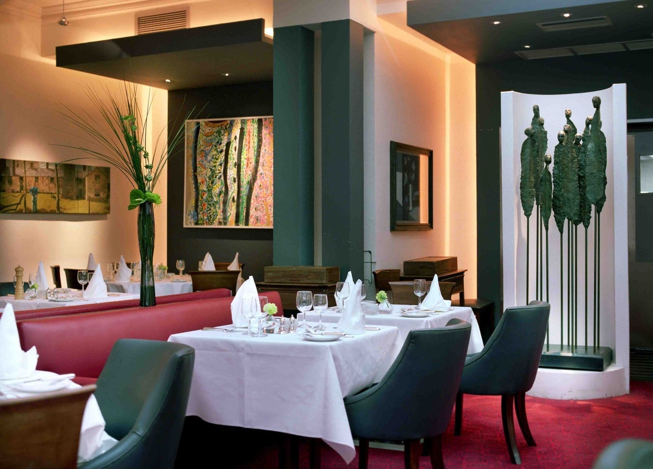 Restaurant dining room with a green sculpture