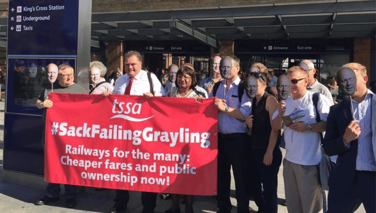 TSSA campaigners including Manuel Cortes and Diane Abbott MP with banner saying 'Sack Failing Grayling'