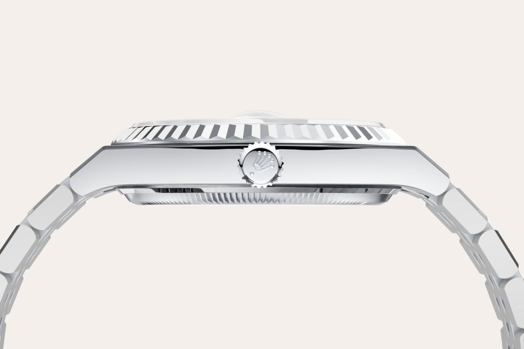 Rolex Land-Dweller 36 in Oyster, 36 mm, platinum with a Ice blue, honeycomb motif dial, Fluted bezel, and Platinum bracelet