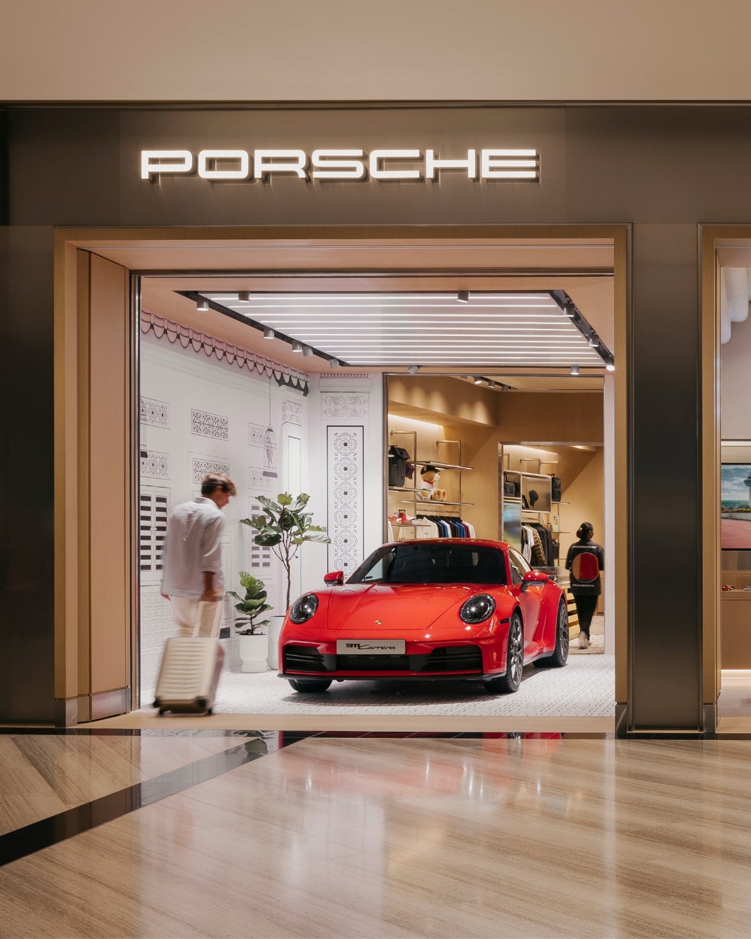 Retail store Singapore - red Porsche 911 sports car - wood veneer - interior design