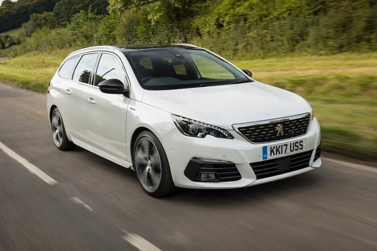 Peugeot 308 SW (2014-2021) Review: exterior front three quarter photo of the Peugeot 308 SW on the road