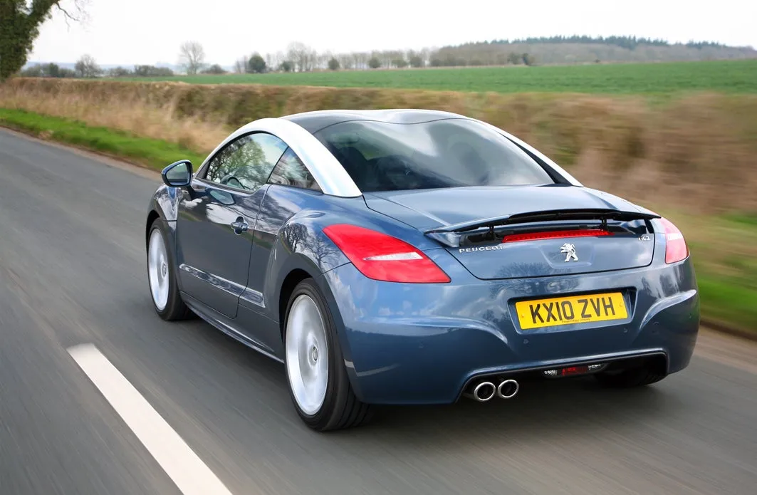 Peugeot RCZ (2010-2015) Review: exterior rear three quarter photo of the Peugeot RCZ on the road