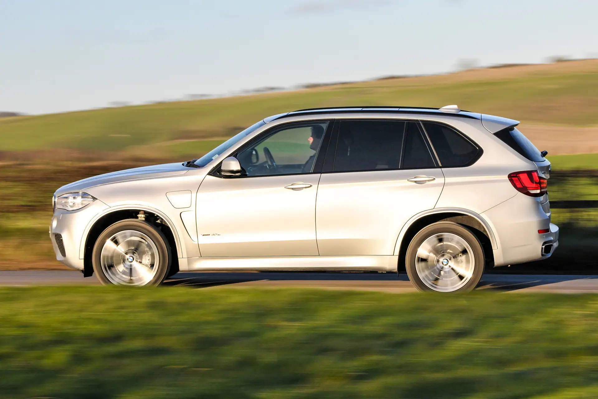 BMW X5 (2014-2018) Review:  Exterior side photo of the BMW X5 on the road