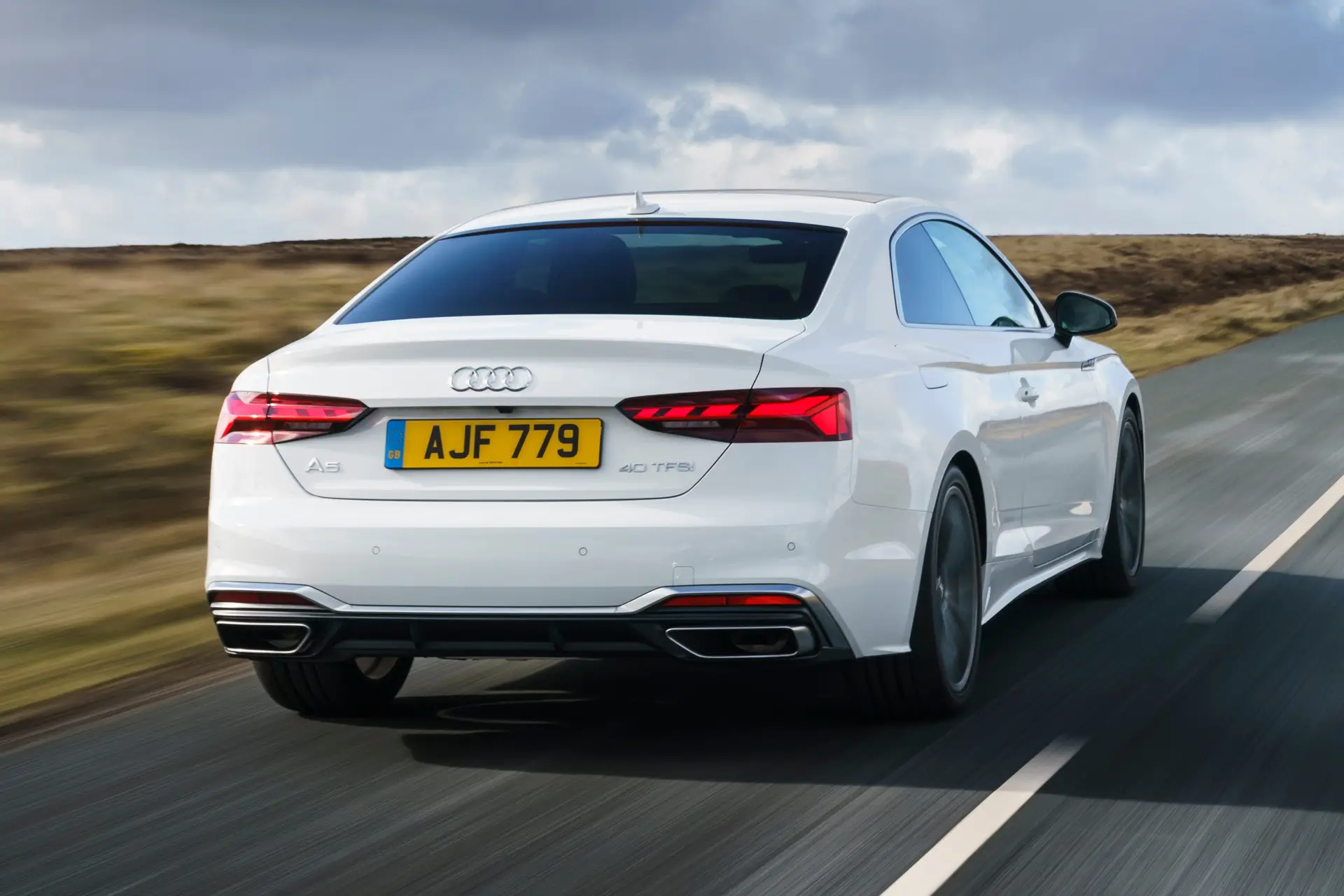 Audi A5 Review 2023: driving rear-three quarter 