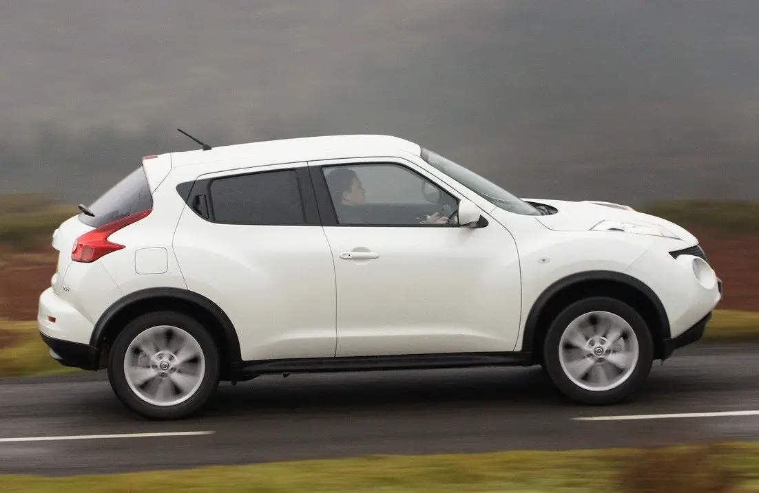Nissan Juke (2010-2019) Review: exterior side photo of the Nissan Juke on the road