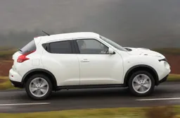 Nissan Juke (2010-2019) Review: exterior side photo of the Nissan Juke on the road