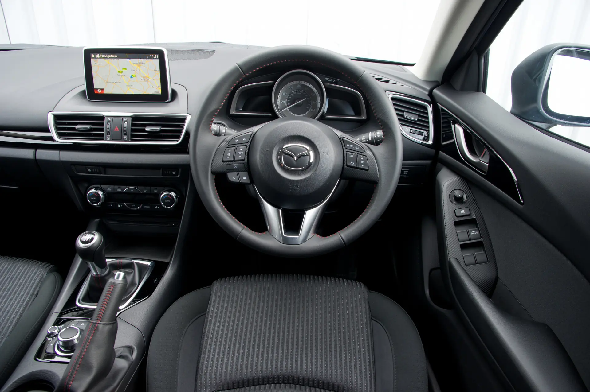 Mazda 3 (2014-2019) Review: interior close up photo of the Mazda 3 dashboard