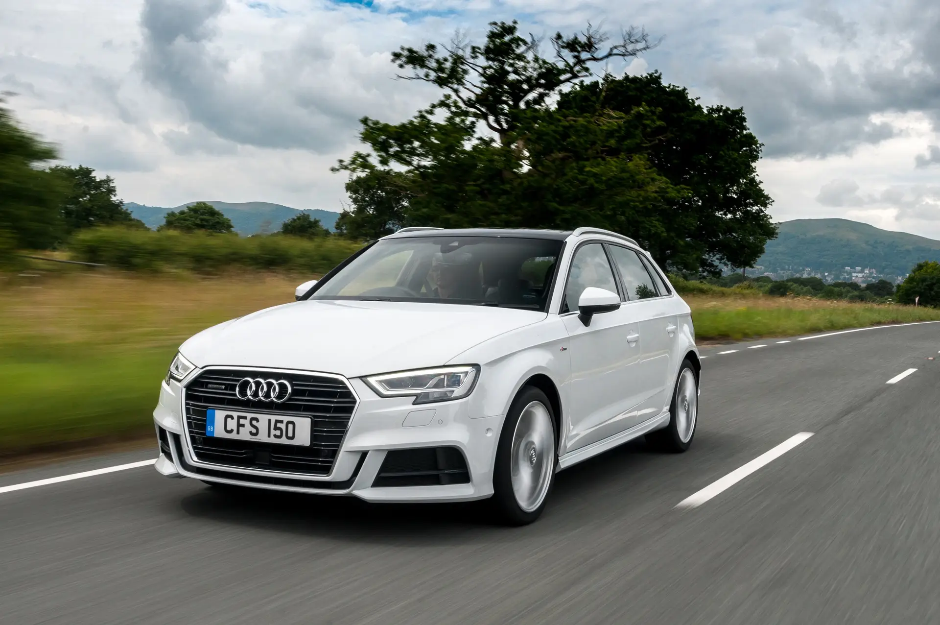 Audi A3 Sportback (2013-2020) Review: exterior front three quarter photo of the Audi A3 Sportback on the road