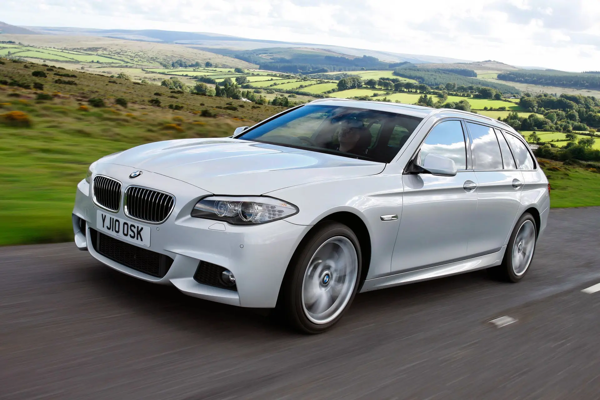 BMW 5 Series Touring (2010-2017) Review: Exterior front three quarter photo of the BMW 5 Series Touring on the road